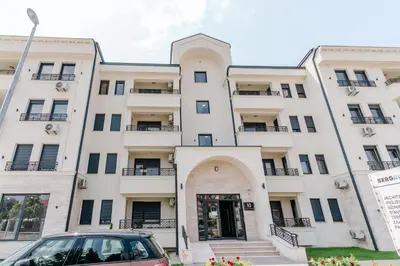 a building with a car parked in front of it at Rajski Kutak in Arandjelovac
