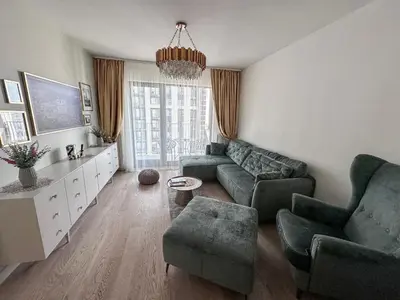 a living room with a couch and chairs and a table at Beldorado Apartments - Belgrade Waterfront Luxury Emerald Apartment 60m2 in Belgrade