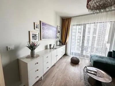 a living room with a white dresser and a couch at Beldorado Apartments - Belgrade Waterfront Luxury Emerald Apartment 60m2 in Belgrade