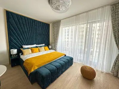 a bedroom with a large bed and a large window at Beldorado Apartments - Belgrade Waterfront Royal Luxury Studio in Belgrade