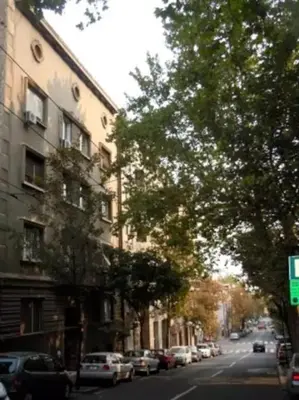 a city street with cars parked on the side of the road at Porto Studio in Belgrade