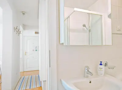 a bathroom with a sink and a mirror at Miu Arena Apartment in Belgrade