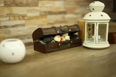 a small box of rocks and a lantern on a table at Apartman Avala Beograd in Beli Potok