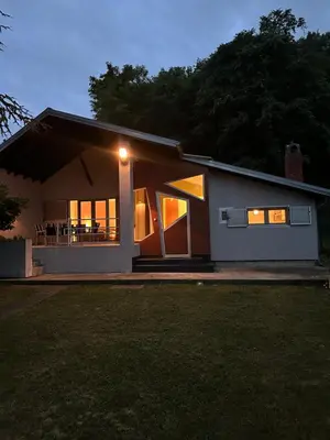 a house with a light on the front of it at Kuca na Dunavu in Belgrade