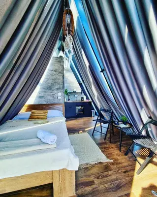 a room with two beds in a tent at Glamping A frame lake Heated pool in Barajevo