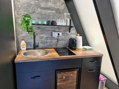 a bathroom with a sink and a counter at Glamping A frame lake Heated pool in Barajevo
