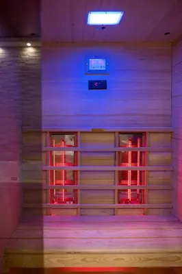 a room with purple and red lights in it at President 034 Royal Spa in Arandjelovac