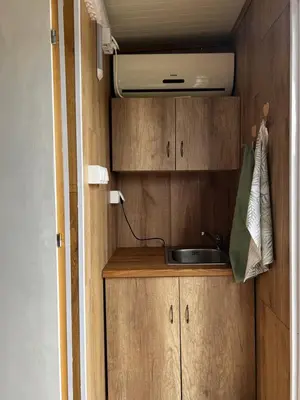 a kitchen with a sink in a caravan at Splav na reci Savi in Ostružnica