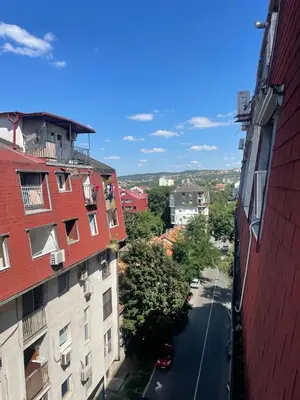 a view of a street between two buildings at Charming studio near downtown in Belgrade