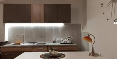 a kitchen with a sink and a lamp on a table at Studio Neimar in Vračar (historical)