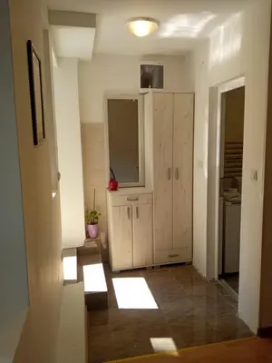 a room with a kitchen with a large cabinet in it at Studio Neimar in Vračar (historical)