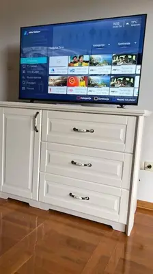 a tv on top of a white dresser at Biser apartman in Belgrade