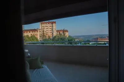 a balcony with a view of a building at Biser apartman in Belgrade