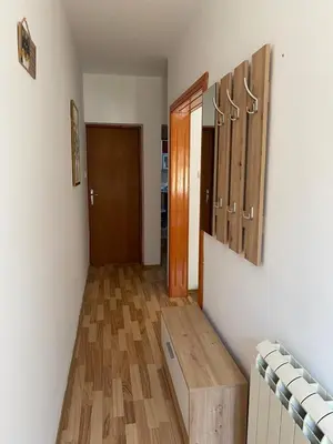 a room with a wooden bench and a door at Jasna in Zemun