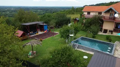 a backyard with a swimming pool and a house at Sava Land in Belgrade