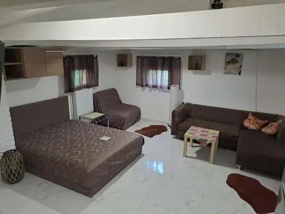 a living room with two couches and a couch at Sava Land in Belgrade