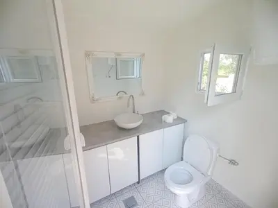a bathroom with a toilet and a sink and a mirror at Sava Land in Belgrade