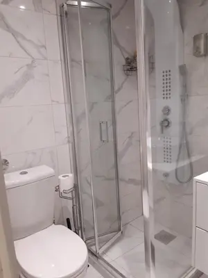 a bathroom with a shower and a toilet at Apartman brdo in Belgrade