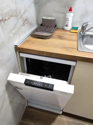 a kitchen with a counter with a sink and a stove at Magenta New Belgrade in Belgrade