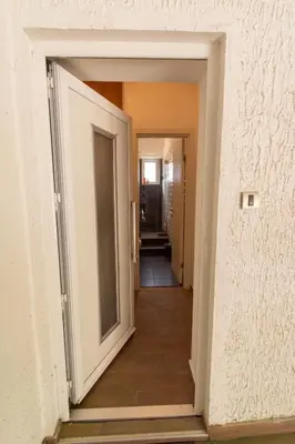 a hallway with an open door into a room at Downtown Heaven in Belgrade