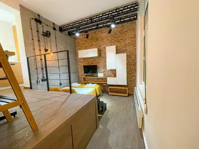 a room with a bed and a brick wall at Downtown Heaven in Belgrade