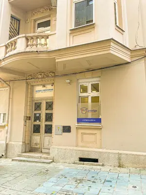 a building with a sign on the door of it at Downtown Heaven in Belgrade