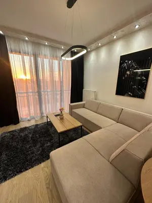 a living room with a couch and a table at THE GATES 210 in Belgrade