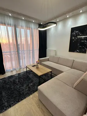 a living room with a couch and a table at THE GATES 210 in Belgrade