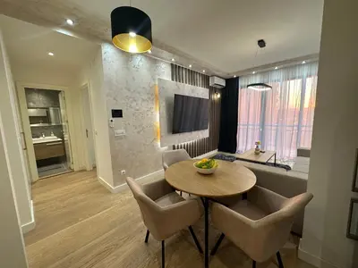 a living room with a table and a couch at THE GATES 210 in Belgrade