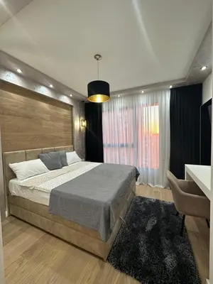 a bedroom with a large bed and a window at THE GATES 210 in Belgrade