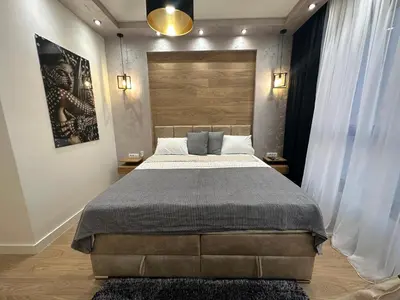 a bedroom with a large bed in a room at THE GATES 210 in Belgrade