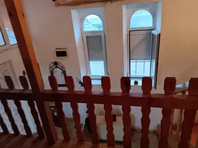 a row of chairs in a room with windows at Maravilja in Filmski Grad