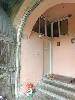 an entrance to a house with a door and stairs at Maravilja in Filmski Grad