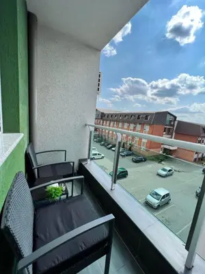 a balcony with a view of a parking lot at Apartman Maja in Ruma