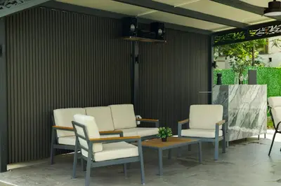 a group of chairs and a table on a patio at Vila Grof in Vinča