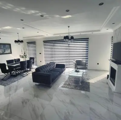 a large living room with a couch and a table at Vila Grof in Vinča