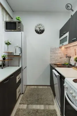 a small kitchen with a refrigerator and a stove at Astra M in Vračar (historical)