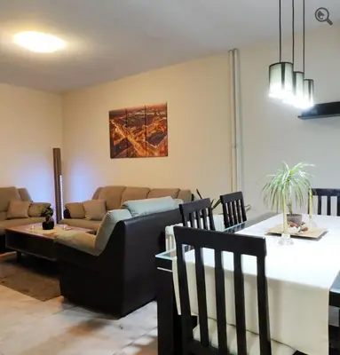 a living room with a couch and a table at Astra M in Vračar (historical)