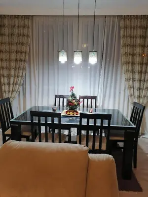a dining room table with a christmas tree on it at Astra M in Vračar (historical)