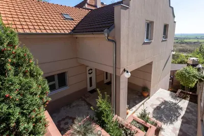 an aerial view of a house with a christmas tree at 1-bedroom apartment near airport in Surčin