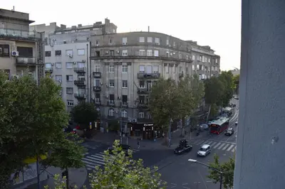 a view of a city street with a large building at Manila Apartment in Belgrade