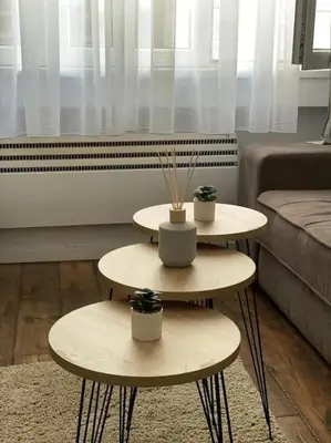 two tables with plants on them in a living room at Apartment in Belgrade with small parking space in Belgrade