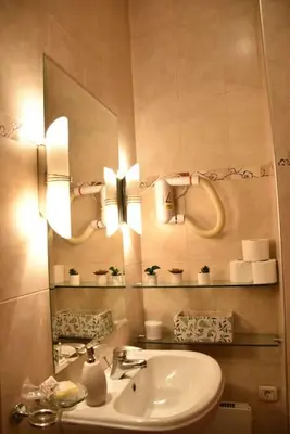 a bathroom with a sink and a mirror at Apartment in Belgrade with small parking space in Belgrade