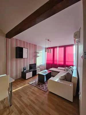 a living room with a couch and a tv at Belgrade Loft Apartments in Novi Beograd