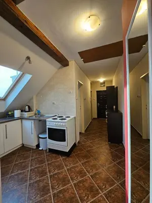 a kitchen with a stove top oven in a room at Belgrade Loft Apartments in Novi Beograd