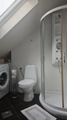 a bathroom with a toilet and a glass shower at Belgrade Loft Apartments in Novi Beograd