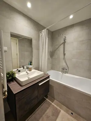 a bathroom with a tub and a sink and a bath tub at Best Apartments-Aqua-Belgrade Waterfront in Belgrade