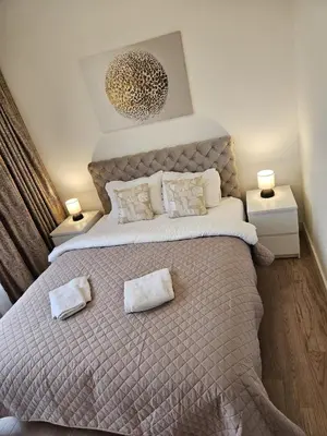 a bedroom with a large bed with two pillows on it at Best Apartments-Aqua-Belgrade Waterfront in Belgrade