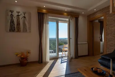a living room with a view of a balcony at 1-Bedroom Apartment with Balcony in Ledine
