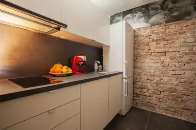 a kitchen with a red appliance on a counter at Dorcol Rooftop Apartment in Belgrade